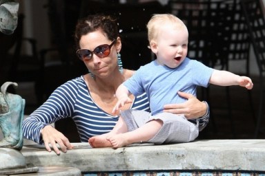 Minnie Driver, blue and white striped top, turquoise dangle earrings, sunglasses,